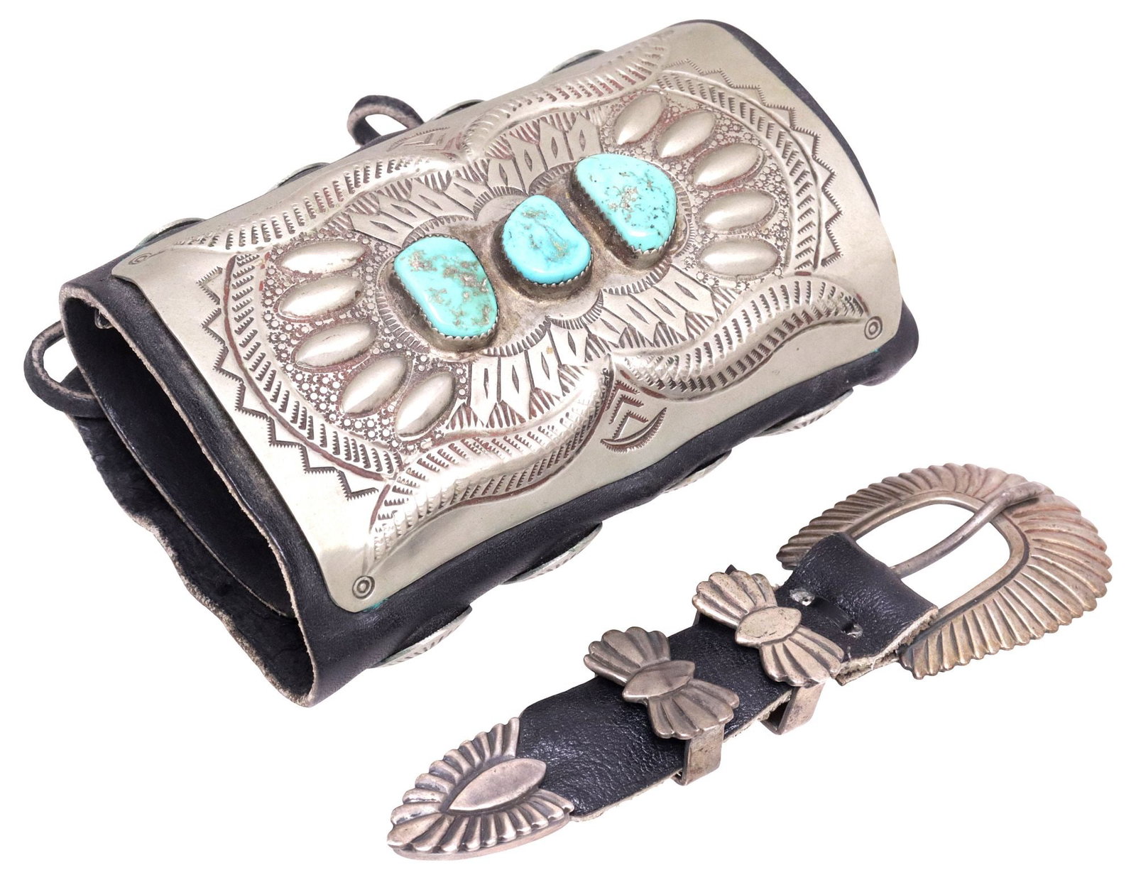 (2) NATIVE AMERICAN KETOH BOW GUARD & STERLING RANGER BUCKLE SET: (lot of 2) Native American accessories, both likely Navajo, including: (1) ketoh/ bow guard, large silver-tone metal plaque with (three) bezel-set turquoise cabochons, among repousse feathers and stam
