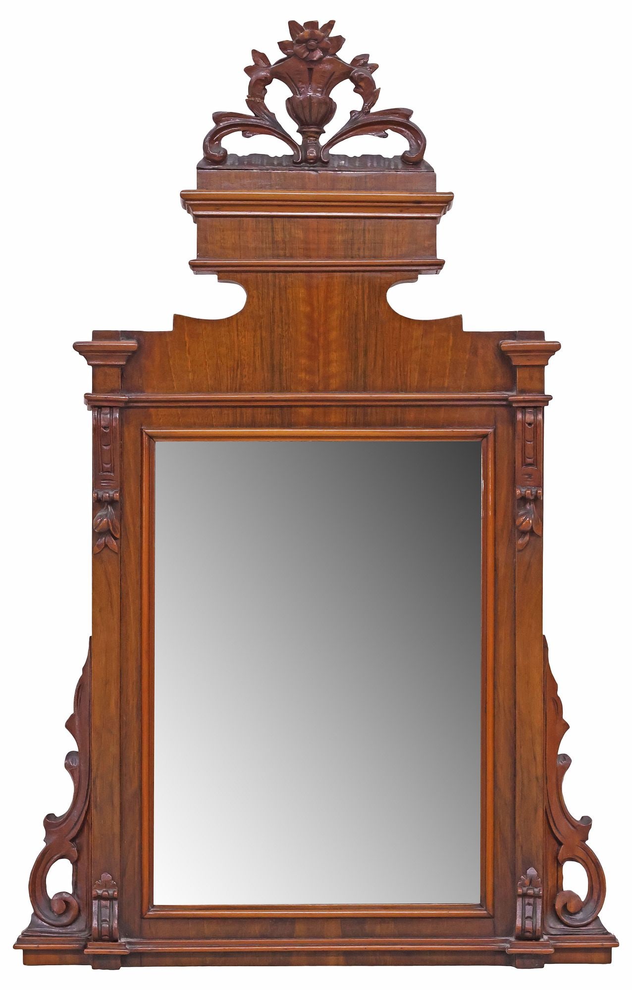 ITALIAN CARVED WALNUT ARCHITECTURAL MIRROR: Italian carved walnut architectural mirror, 19th c., having flowering urn crest, above stepped cornice and rectangular frame, encasing flat mirror plate, likely previously served as a backsplash, appr