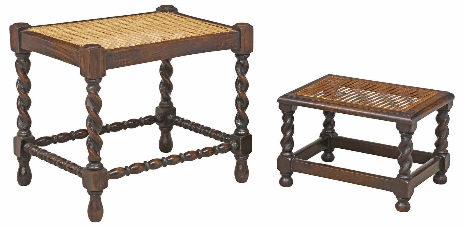 (2) ENGLISH CANED OAK BARLEY TWIST STOOLS / OTTOMANS: (lot of 2) English Edwardian oak stools or ottomans, early 20th c., each with caned seat, raised on barley twist supports, joined by box stretcher, varied sizes, including: (1) approx 17.5"h, 20"w, 15