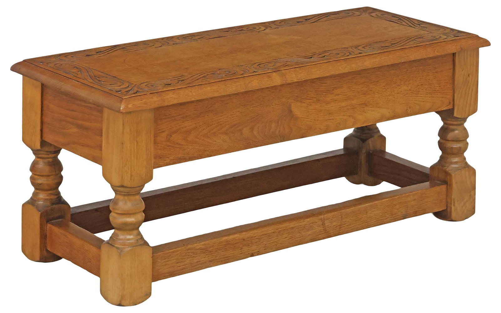 ENGLISH CARVED OAK LIFT-TOP BOX STOOL / LOW BENCH: English oak box stool/ low bench, early 20th c., rectangular hinged top with carved scrolling foliate motif, revealing open storage, on stretcher-joined turned legs, approx 13"h, 29.5"w, 12.25"d