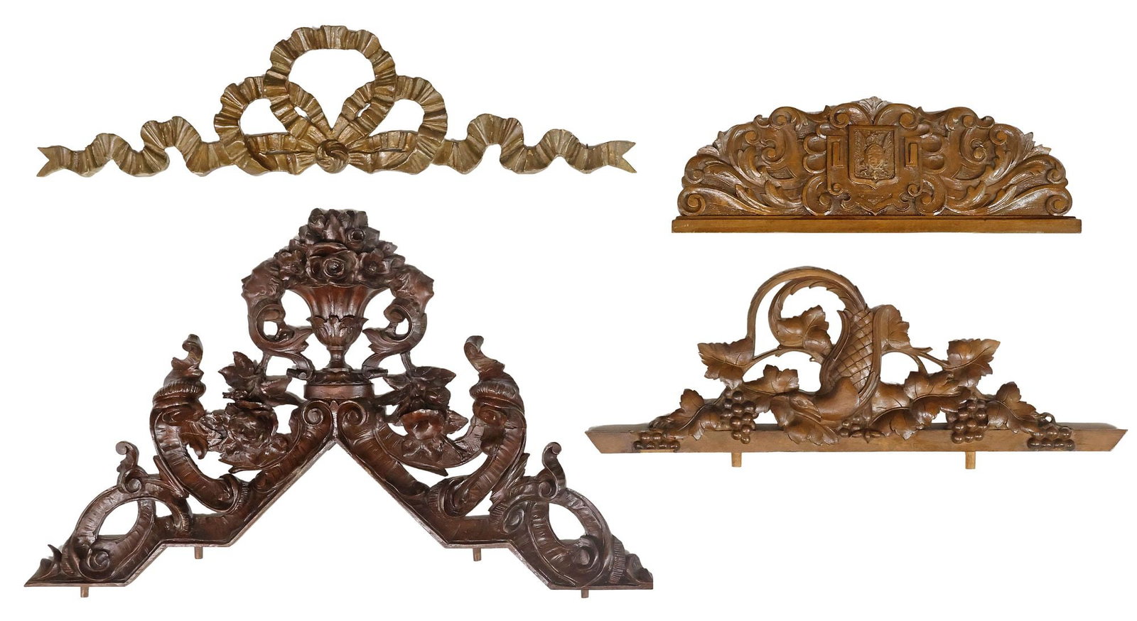 (4) ITALIAN CARVED WALNUT & GILT-PAINTED ARCHITECTURAL CRESTS: (lot of 4) Italian carved walnut and paint-decorated wood crests/ architectural elements, 19th/ early 20th c., including: (1) centering rose-filled urn, flanked by pierced scrollwork, of angular form;