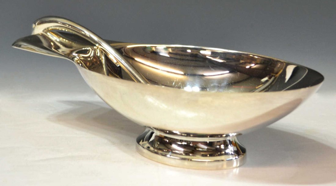 CHRISTOFLE MODERNIST STYLE SILVERPLATE SAUCIERE: Christofle silver plate sauciere and spoon, 'Cygne', in the modernist taste, after the design by Christian Fjerdingstad, the oval dish with extended handle having rounded edges, raised on a short foot