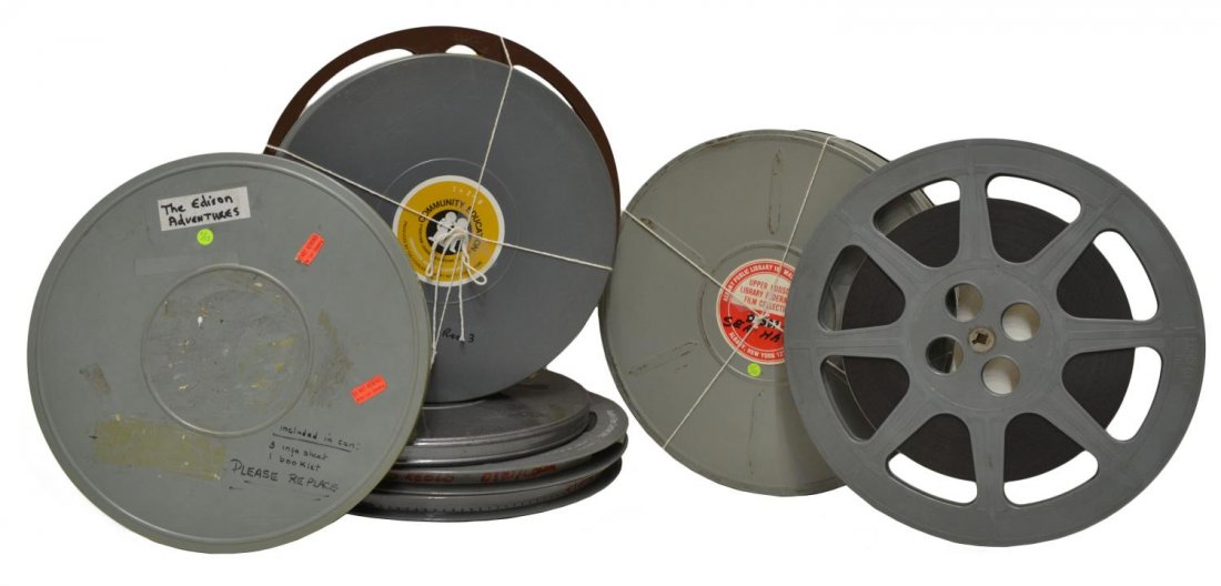 (5) 16MM MOVIES, WIZARD OF OZ, SNOW WHITE, OTHERS: (lot of 5) 16mm movies: Lights of New York (2 reels); Wizard of Oz (3 reels); Edison Adventures (1 reel); Sea Hawk (3 reels); Snow White (3 reels), largest reel: 14"d, total: 54lbs **Provenance: The R