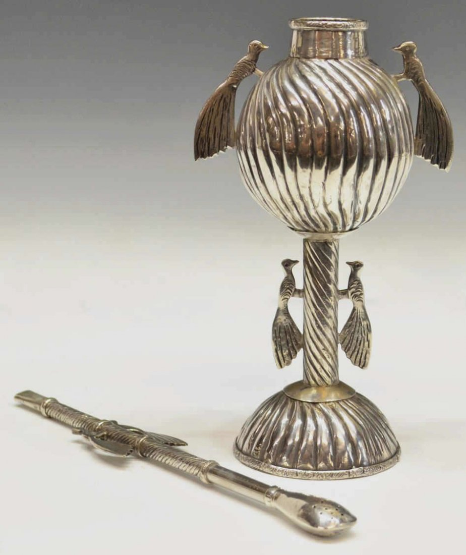 SOUTH AMERICAN SILVER BIRD MATE CUP & BOMBILLA: South American silver mate cup accompanied by the original bombilla (straw), fluted detail on the round bowl and cylindrical stem, mounted with birds, cup: 7"h, straw: 8.25"l, 8.06ozt Start Price: $10