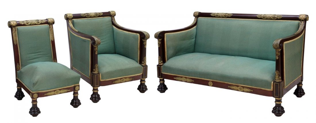 (3) ORMOLU DECORATED FRENCH EMPIRE SALON SUITE: (3) French Empire mahogany framed salon suite, 19th c., each piece decorated with foliate and face formed gilt ormolu, the settee and arm chair with scrolled arms over columnar supports, rising on sub