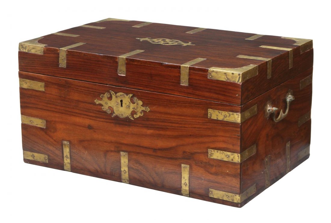 BRITISH COLONIAL BRASS BOUND STORAGE CHEST: British Colonial brass bound rosewood storage chest, the rectangular top with central decorative detail, well fitted interior with dual document slot, lidded cubbies inlaid with scrolled metal work, r