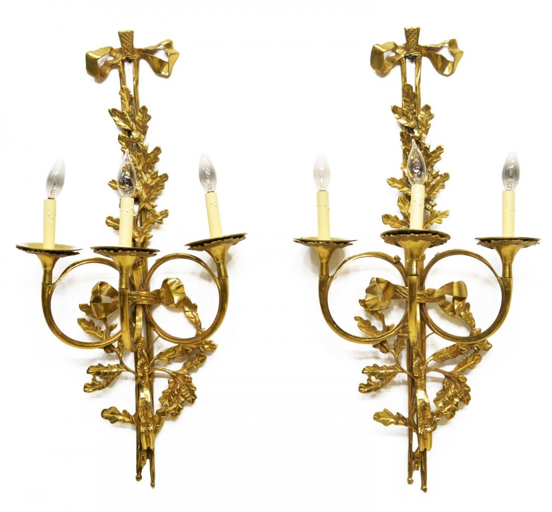 (2) LOUIS XVI STYLE BRASS THREE LIGHT WALL SCONCES: (lot of 2) Louis XVI style brass three light wall sconces decorated with foliate and ribbon decoration, 232.5"h, 15.5"w, 8.75"d, 26lbs Start Price: $150.00