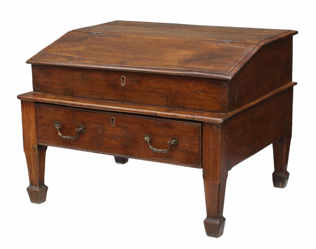 BRITISH COLONIAL TRAVELING SLANT LID DESK: British Colonial teakwood traveling desk, c. 1900, the upper section having a slant lid, opening to storage, integral base with single drawer, rising on four legs, losses / wear with age, approx 18"h,