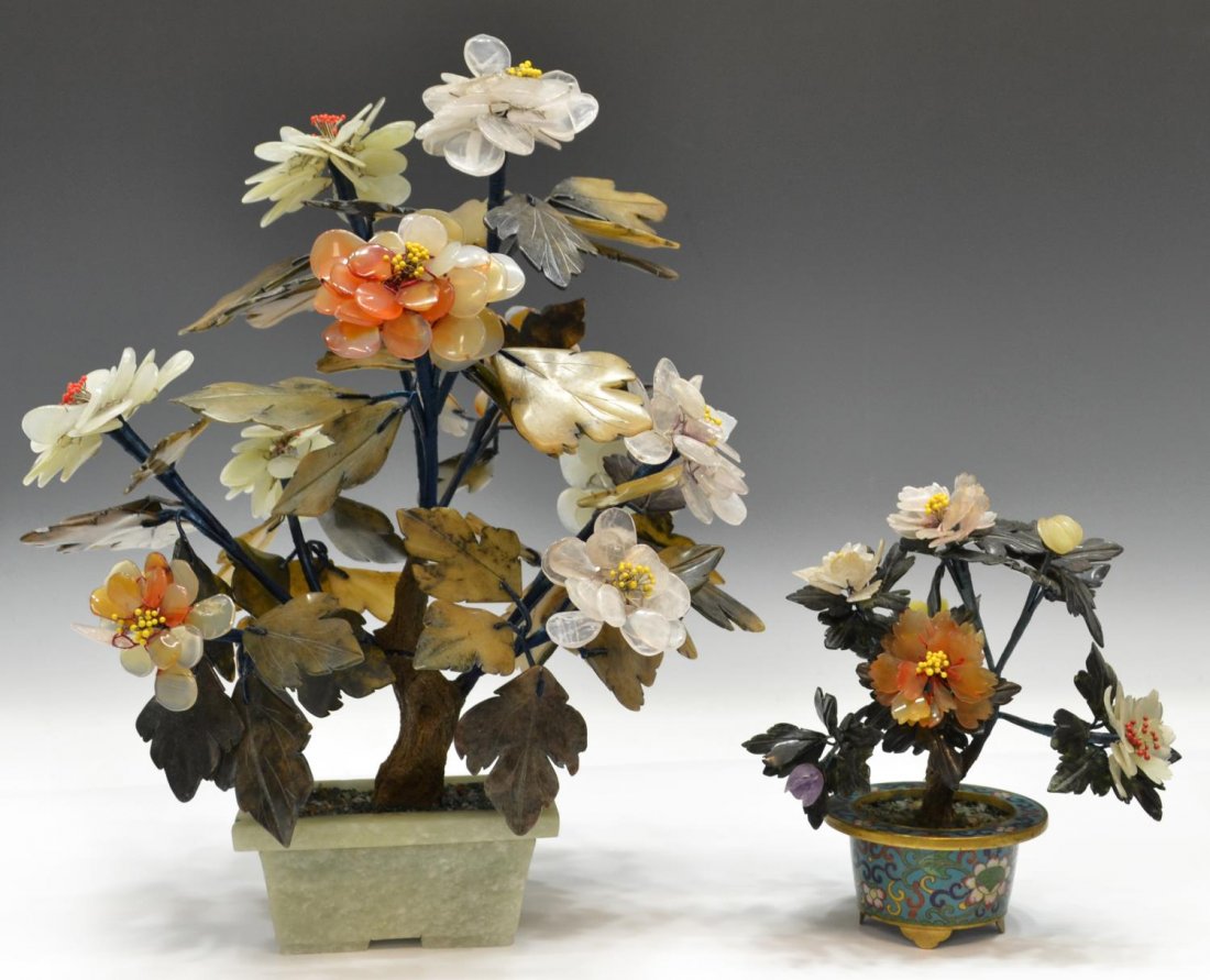 (2) CHINESE HARDSTONE & CLOISONNE ENAMEL TREES: (lot of 2) Chinese hardstone trees, flowering branches of rose quartz, jade, carnelian, etc., comprising: (1) set in a cloisonne enamel pot having flowers amid scrolling tendrils, 7"h; (1) set in a ja