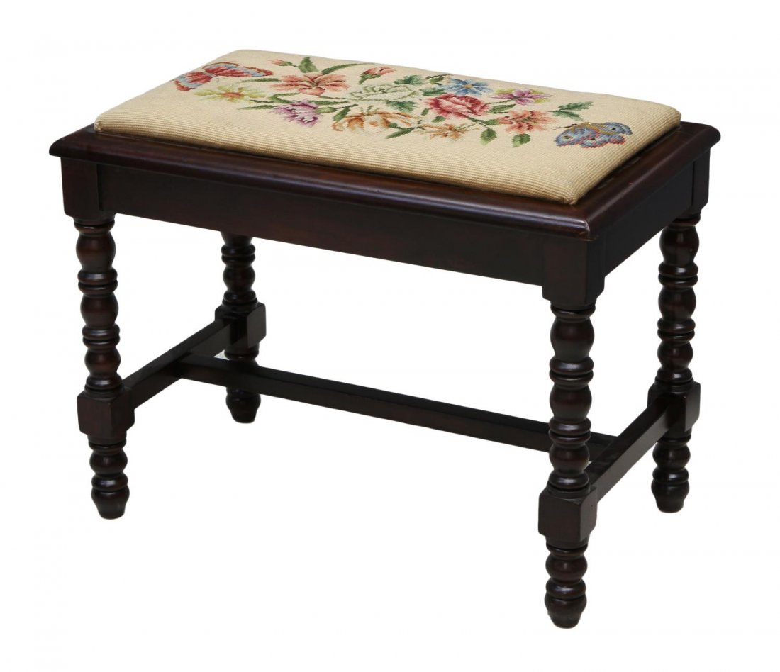 ENGLISH MAHOGANY VANITY NEELEPOINT STOOL: English mahogany finish vanity stool, first half 20th c., rectangular with later needlepoint upholstered seat, rising on stretcher joined turned legs, 18.5"h, 24"w, 14"d Start Price: $50.00