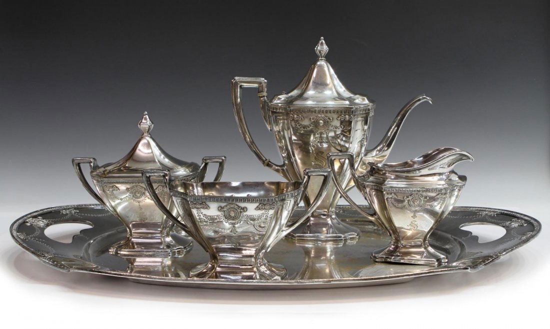(5) W.D. SMITH SILVER CO. SILVERPLATE TEA SERVICE: (set of 5) W.D. Smith Silver Co. silver plate tea service in the 'Adam' pattern, Chicago, IL, comprising: (1) tea pot, 10.25"h; (1) lidded sugar, 6.5"h, 7.5"w (including handles); (1) creamer, 4.5"h,