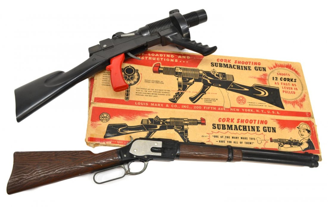(2) TOYS, MARX CORK SUBMACHINE GUN, MATTEL RIFLE: Marx Cork Shooting Submachine Gun, holds 12 corks with six present, original cardboard box in poor condition, 7.5"d, 20"l, 3.5"w, ; (1) Mattel Winchester cap rifle, 26"l, 2.5"h, 1.25"d, both appear to