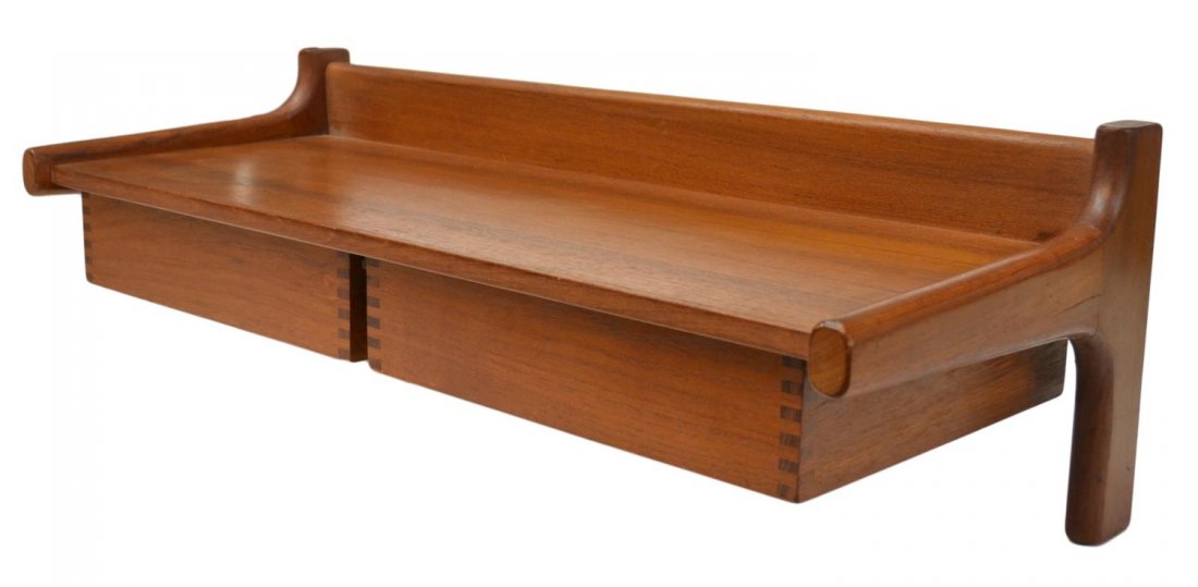 MID-CENTURY MODERN TEAKWOOD HANGING WALL SHELF: Mid-century modern teakwood hanging wall shelf, design by Borge Mogensen (Danish, 1914-1972), two pull out drawers set below partial galleried top, exposed joinery on each drawer, 8.75"h, 27.25"w, 11"