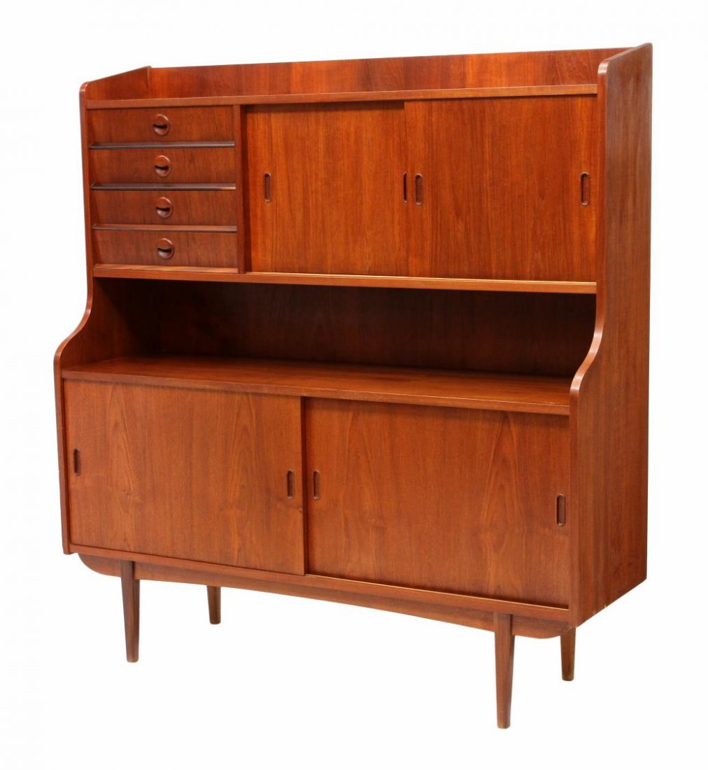 DANISH MID-CENTURY MODERN TEAKWOOD BAR SIDEBOARD: Danish mid-century modern teakwood bar sideboard, c. 1960, the upper part with an open shelf over sliding doors opening to a mirrored bar and shelves, at left four drawers, the lower cabinet with an o