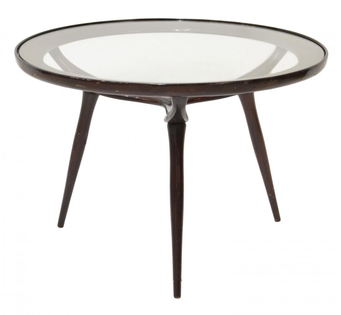 ITALIAN MID-CENTURY SIDE TABLE, MANNER OF PARISI: Mid-century side table, Italy, c. 1950, in the manner of Ico Parisi Ico Parisi (Italian, 1916-1996), a glass top set in the circular wood frame, raised on three tapered supports, 16.25"h, 23.5"diam St