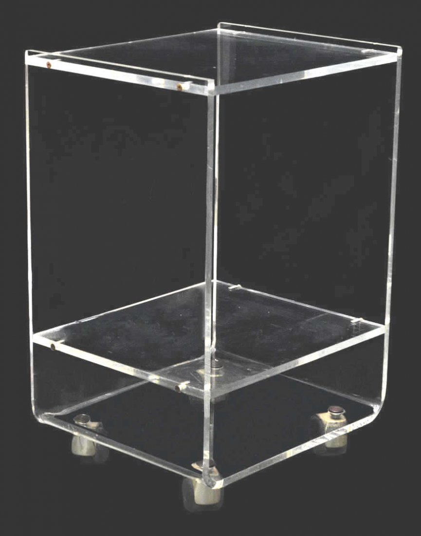 ITALIAN MODERN PLEXIGLASS ROLLING SERVICE CART: Italian modern plexiglass service trolley, c. 1970's, diminutive form having three tiers, moving on large round casters, surface wear, approx 25"h, 16.5"w, 14"d Start Price: $100.00