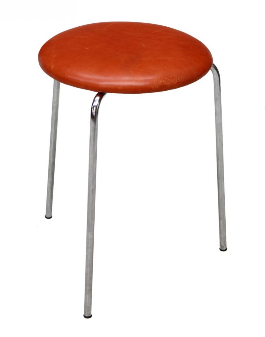 MID-CENTURY MODERN STOOL, FRITZ HANSEN, DENMARK: Mid-century modern stool, for Fritz Hansen, Denmark, circular worn leather top raised on three tubular chromed steel supports, retaining manufacturer's tag underside, 18"h, 14.25"diam Start Price: $50