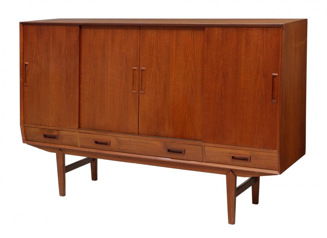 DANISH MID-CENTURY MODERN TEAKWOOD SIDEBOARD: Danish mid-century modern teakwood sideboard, c. 1960, four sliding doors opening to shelves, tray drawers, and a mirrored section, three lower exterior drawers, all rising on tapered turned legs, ven