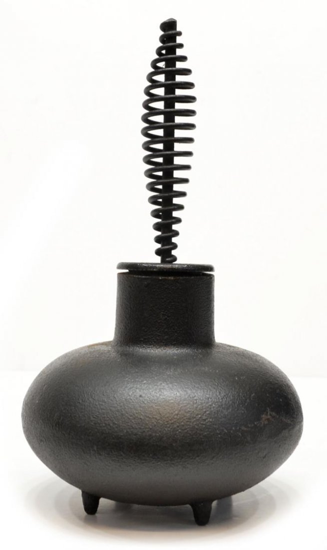 GEORGE NELSON DESIGN CAST IRON FIRESTARTER: American mid-century cast iron firestarter, design by George Nelson (1908-1986) produced by Howard Miller, unmarked, 11.25"h, 6"w, 7lbs Start Price: $150.00