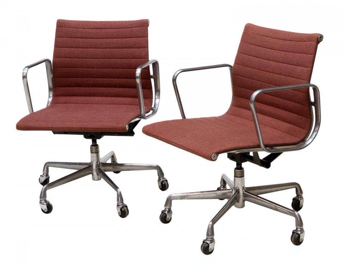 (PAIR) EAMES ALUMINUM TASK SWIVEL ARM CHAIRS: (pair) Group Task Swivel Arm Chairs, design by Charles and Ray Eames for Herman Miller, a polished aluminum frame, brown upholstery with horizontal pleating, rising on five leg star base with castors,