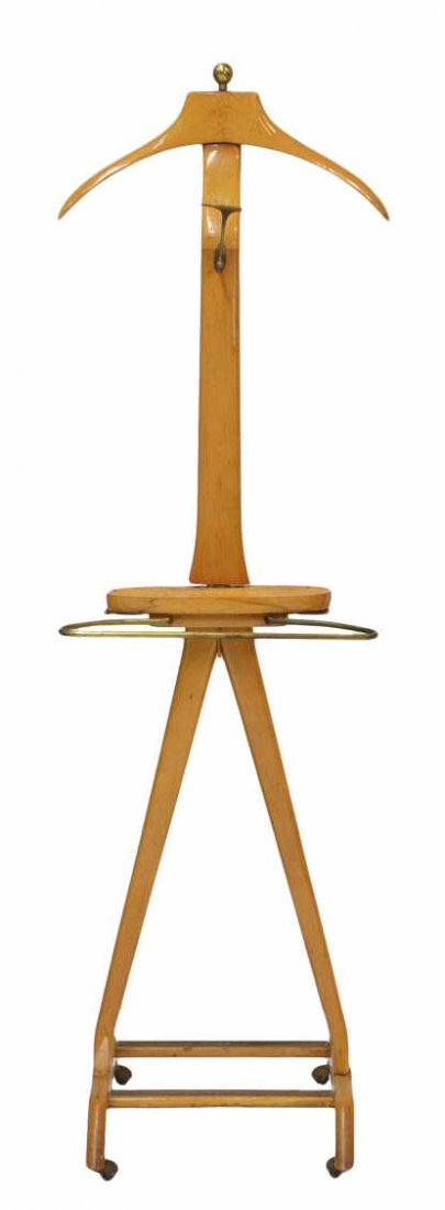 ITALIAN C. 1960 CLOTHES VALET: Italian modern clothes valet, c. 1960, coat hanger, hooks, tray, one vertical support with slight wood loss, movable on castors, 57"h, 17.5"w, 15"d Start Price: $80.00