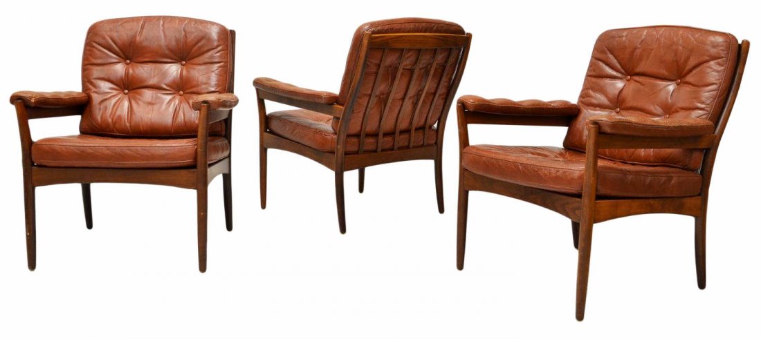 (3) SWEDISH MID-CENTURY MOBLER LEATHER ARM CHAIRS: (set of 3) Swedish mid-century modern arm chairs by Gote Mobler, c.1970, having slat backs, buttoned Elmo leather cushions, leather padded arms, rising on tapered turned legs, 33"h, 28"w, 25.5"d Start