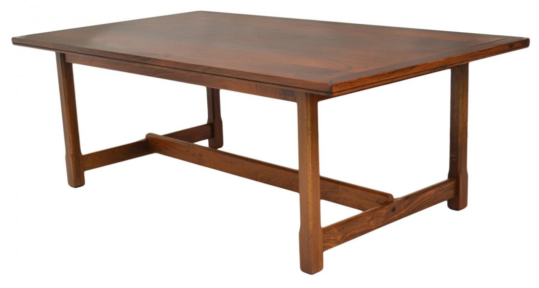 NORWEGIAN MID-CENTURY ROSEWOOD COFFEE TABLE: Norwegian mid-century modern rosewood coffee table, Haug Snekkeri Bruksbo, c. 1960, the rectangular top, raised on shaped legs with block feet, 19.75"h, 55"w, 31.5"d Start Price: $250.00