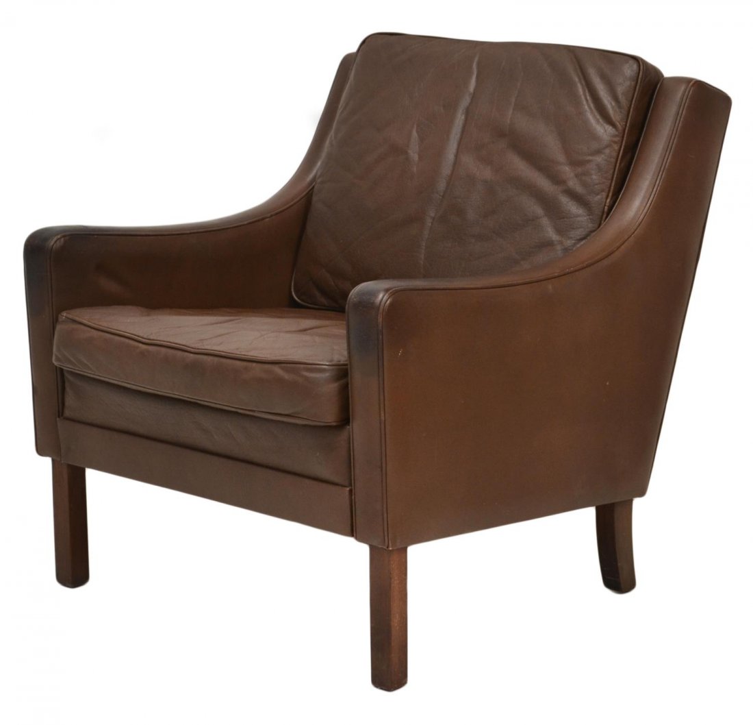 DANISH MID-CENTURY MODERN BROWN LEATHER ARMCHAIR: Danish mid-century modern brown leather armchair, rising on four square wood supports, wear to leather, 29.25"h, 26.5"w, 32.75"d Start Price: $200.00