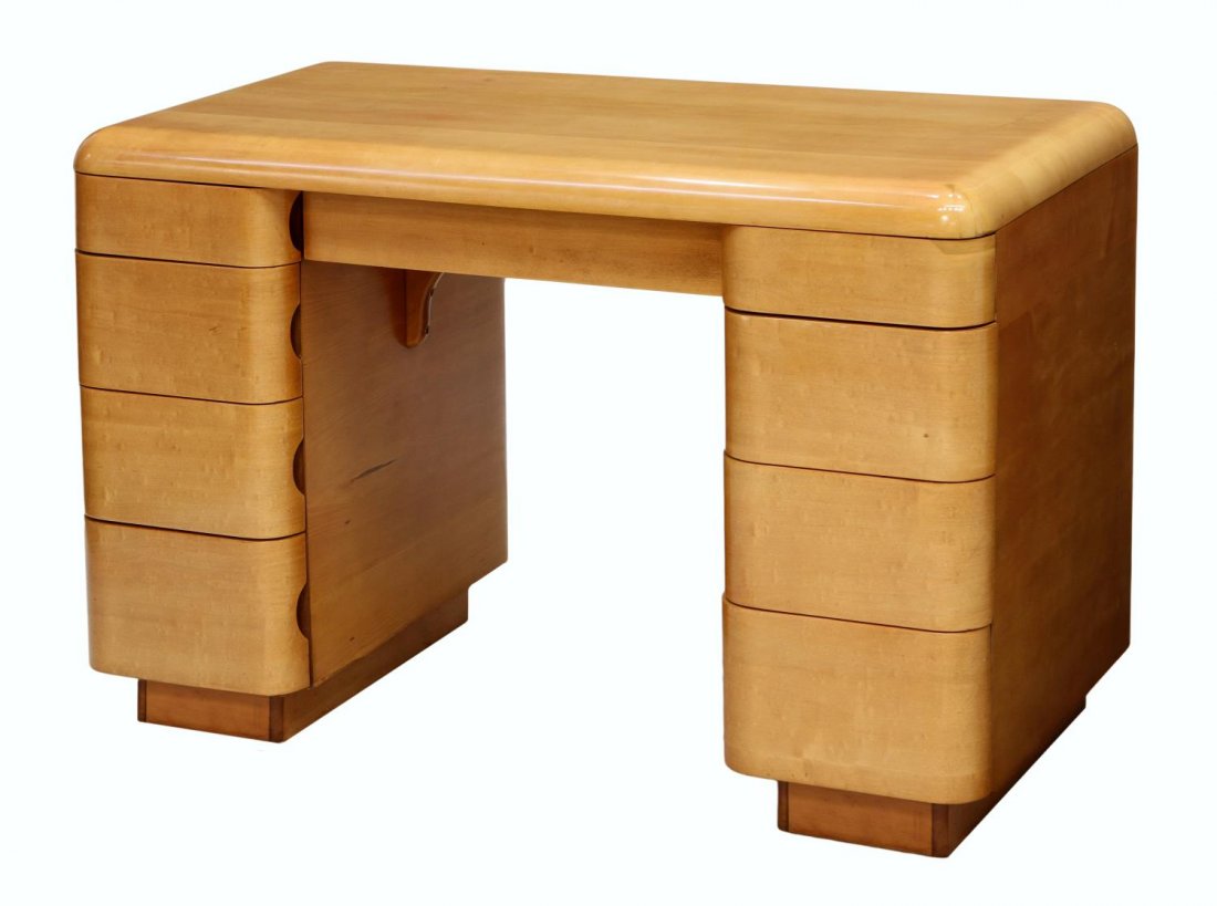 MODERN PLYMOLD DESK, PAUL R. GOLDMAN FOR PLYCRAFT: Plymold desk, c. 1940, design by Paul R. Goldman (c. 1914-2003) for Plycraft Company, Lawrence, Mass., rectangular with curved edge top, a central frieze drawer with two four drawer pedestals, the dra