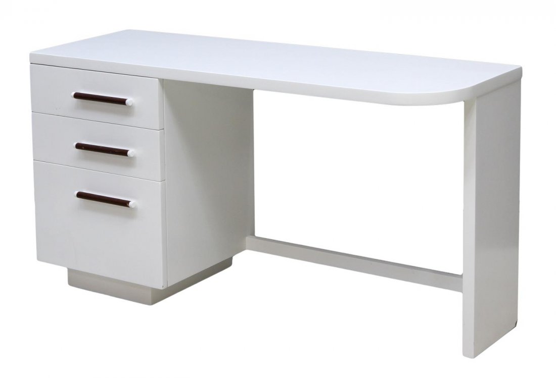 MID-CENTURY MODERN LACQUER VANITY, HERMAN MILLER: Mid-century modern white lacquer vanity / desk, design by Gilbert Rohde (American, 1894-1944) for Herman Miller, the rectangular top with one curved edge set above three drawers, tubular form handles,