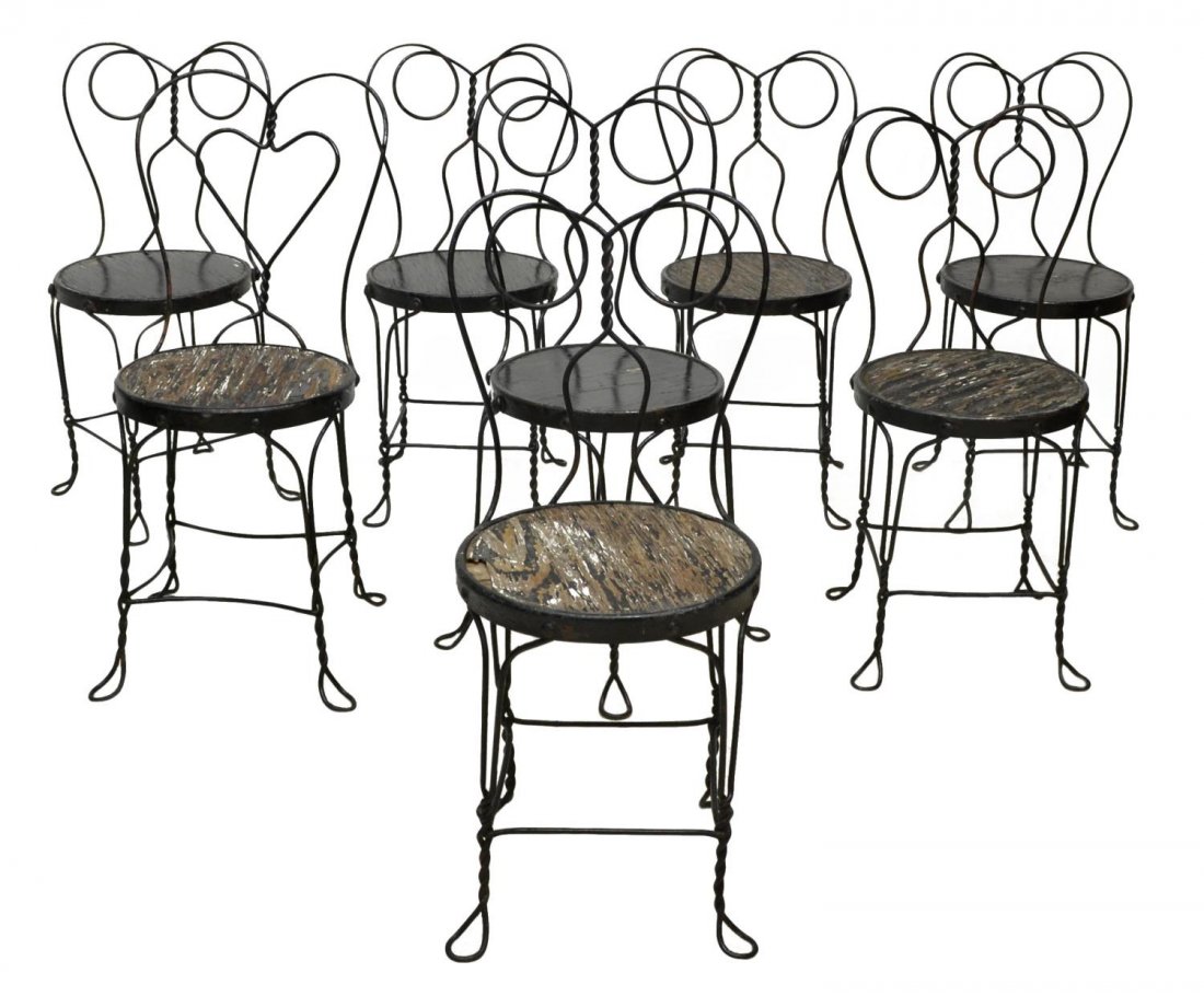 (8) AMERICAN IRON & PAINTED WOOD ICE CREAM CHAIRS: (set of 8) American iron and painted wood ice cream chairs, twist wire legs, one with heart at back, overall with extensive loss to paint on circular seat, 33.75"h, 14.5"diam Start Price: $80.00