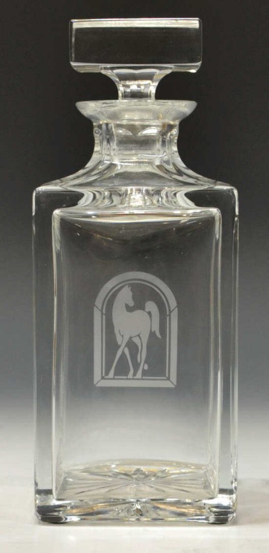 COLORLESS ETCHED GLASS DECANTER, HORSE: Colorless etched glass decanter, portrait of an Arabian horse, the bottle of square form with starburst underfoot, 9.25"h, 4.75lbs *Provenance: The estate of Douglas B. Marshall (1917-2007) and his wi