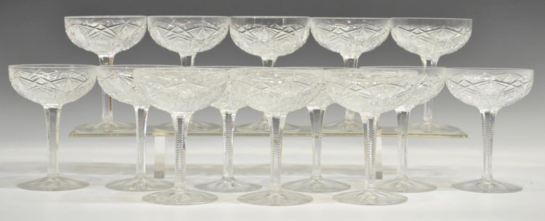 (14) BACCARAT CUT CRYSTAL 'LAGNEY' CHAMPAGNE STEMS: (lot of 14) Baccarat crystal champagne coupe/ sherbet glasses, in the 'Lagny' pattern, elaborate cut star motif with notched stem, approx 5.25"h, 8lbs total *Provenance: The estate of Douglas B. Marsh