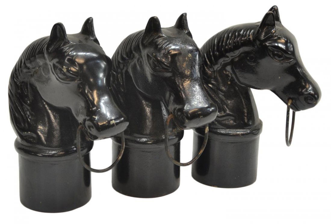 (3) VINTAGE IRON HORSE HEAD HITCHING POST FINALS: (lot of 3) Vintage cast iron horse head hitching post finals, worn black paint, 11.25"h, 32lbs total *Provenance: The estate of Douglas B. Marshall (1917-2007) and his wife, Margaret Cullen Marshall.