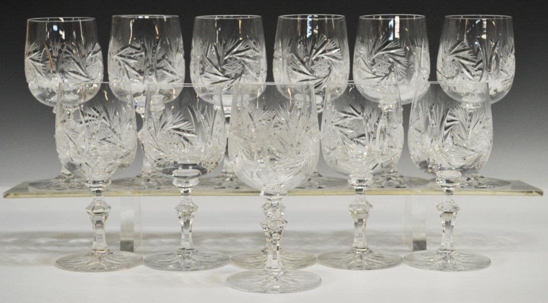 (12) CZECHOSLOVAKIAN CUT CRYSTAL WINE GOBLETS: (lot of 12) Czechoslovakian cut crystal white wine stems, in 'Pinwheel' pattern with notched paneled stem, 5.75"h, 5.25lbs total *Provenance: The estate of Douglas B. Marshall (1917-2007) and his wife