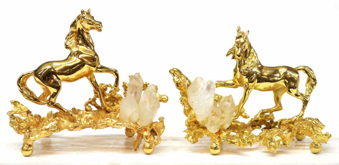 PARIS GILT BRONZE HORSES, CLAUDE VICTOR BOELTZ: (pair) French gilded bronze horse sculptures, by Claude Victor Boeltz (France, b. 1937), each posed upon a rocky openwork ground, issuing a quartz crystal formation, raised on four ball feet, signed v