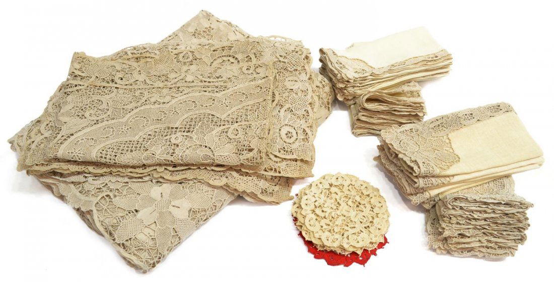 (49) VINTAGE LACE TABLE LINENS: (set of 49) Vintage lace table linens, similarly patterned in a floral motif: (1) tablecloth, 130"l, 64"w; (1) rectangular runner, stains, 50.25"l, 16.25"w; (12) napkins, small floral to corner, 16"h,