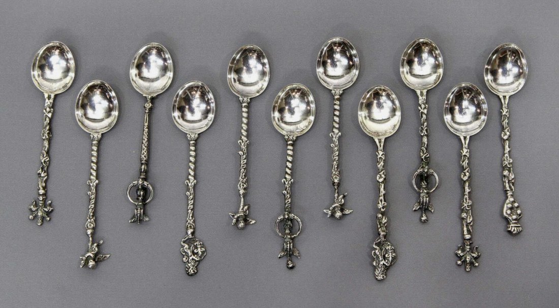 (11) CASED ITALIAN 800 SILVER DEMITASSE SPOON SET: (set of 11) Italian 800 silver demitasse spoons, patterned stems, heraldic and figural finials, fitted in original worn case with decorative exterior, 2.66ozt *Provenance: The estate of Douglas B. Mar