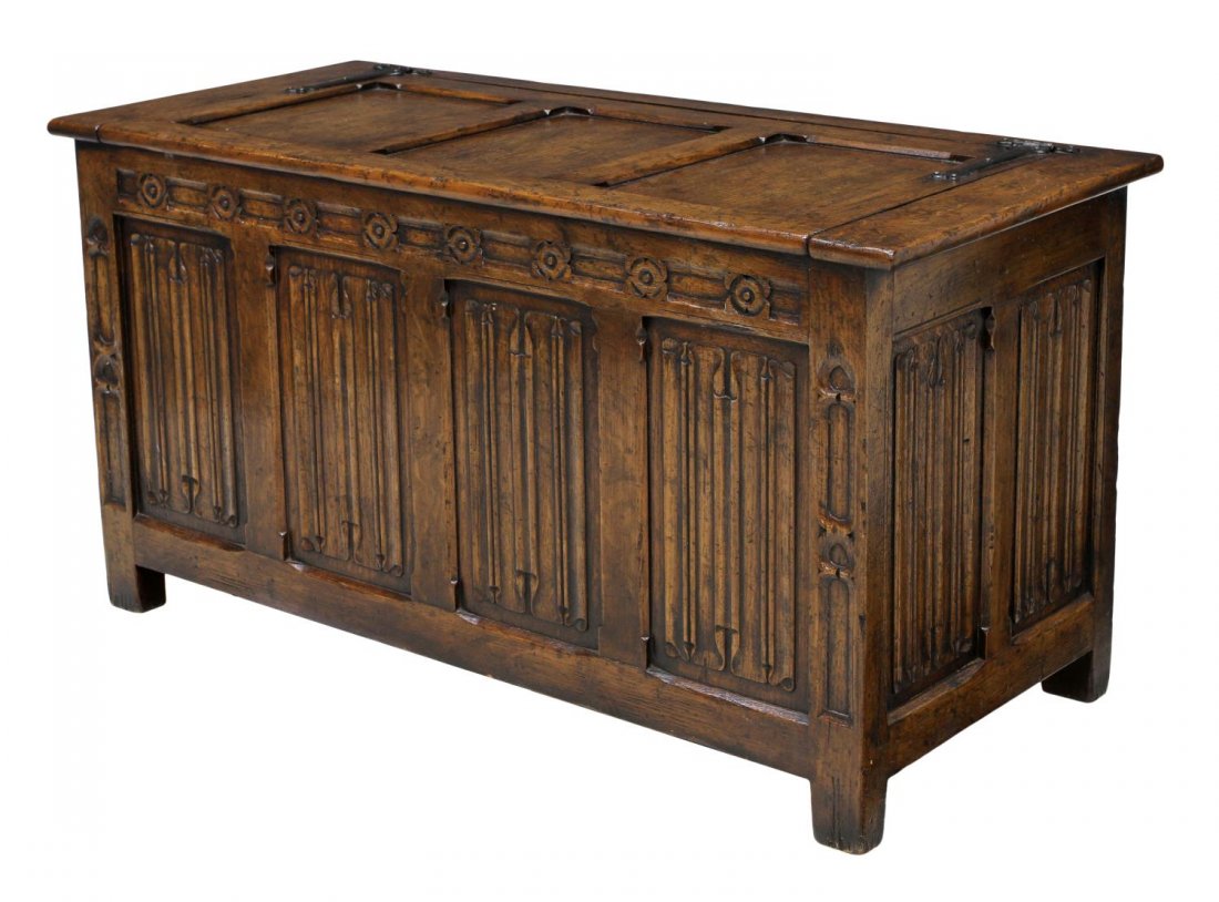 ENGLISH STYLE LINEN FOLD CARVED STORAGE CHEST: Oak storage chest, long iron hinges attach the paneled top to the rectangular case, carved on three sides with linen fold and ornamental detail, approx 24"h, 46.75"w, 20"d *Provenance: The estate of D