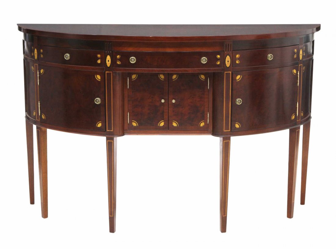 MAHOGANY HEPPLEWHITE STYLE SIDEBOARD: Mahogany Hepplewhite style bow front sideboard, late 20th c., three frieze drawers over four doors, raised on tapered square inlaid legs, 40.5"h, 65"w, 21.75"d *Provenance: The estate of Douglas B. Ma