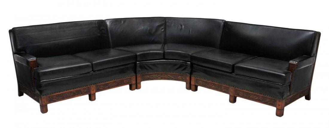 ROMWEBER THREE PIECE LEATHER SECTIONAL SOFA: Romweber three piece black leather upholstered cushioned sectional sofa, Batesville, Indiana, carved grape vines on the oak frame, black leather affixed with nail head accents, one piece retaining mak