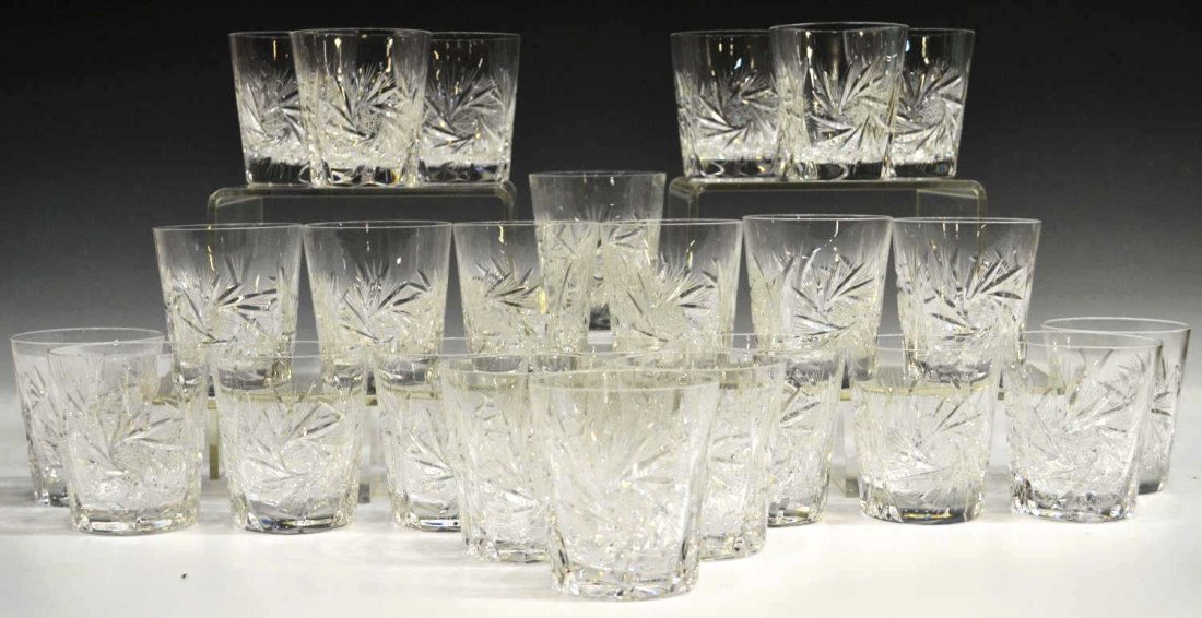 (25) CZECHOSLOVAKIAN CUT CRYSTAL TUMBLERS: (lot of 25) Czechoslovakian cut crystal old fashioned glasses, in 'Pinwheel' pattern with starburst base, approx 3.5"h, 13.75lbs total *Provenance: The estate of Douglas B. Marshall (1917-2007) and hi