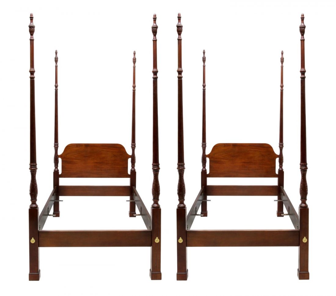 (2) MAHOGANY SINGLE SIZE FOUR POSTER BEDS: (pair) Mahogany finish single size poster beds, each with finial topped ribbed posts, 87"h, 43.25"w, inside: 40"w, 75"l *Provenance: The estate of Douglas B. Marshall (1917-2007) and his wife, Margare