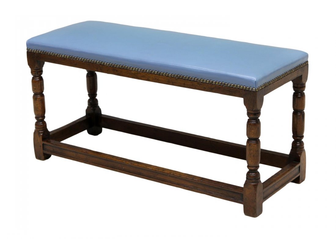 UPHOLSTERED OAK STRETCHER BASE BENCH: Blue upholstered bench, the rectangular top over turned oak supports, joined by stretchers, brass tack accents, 17.5"h, 35.75"w, 13"d *Provenance: The estate of Douglas B. Marshall (1917-2007) and his