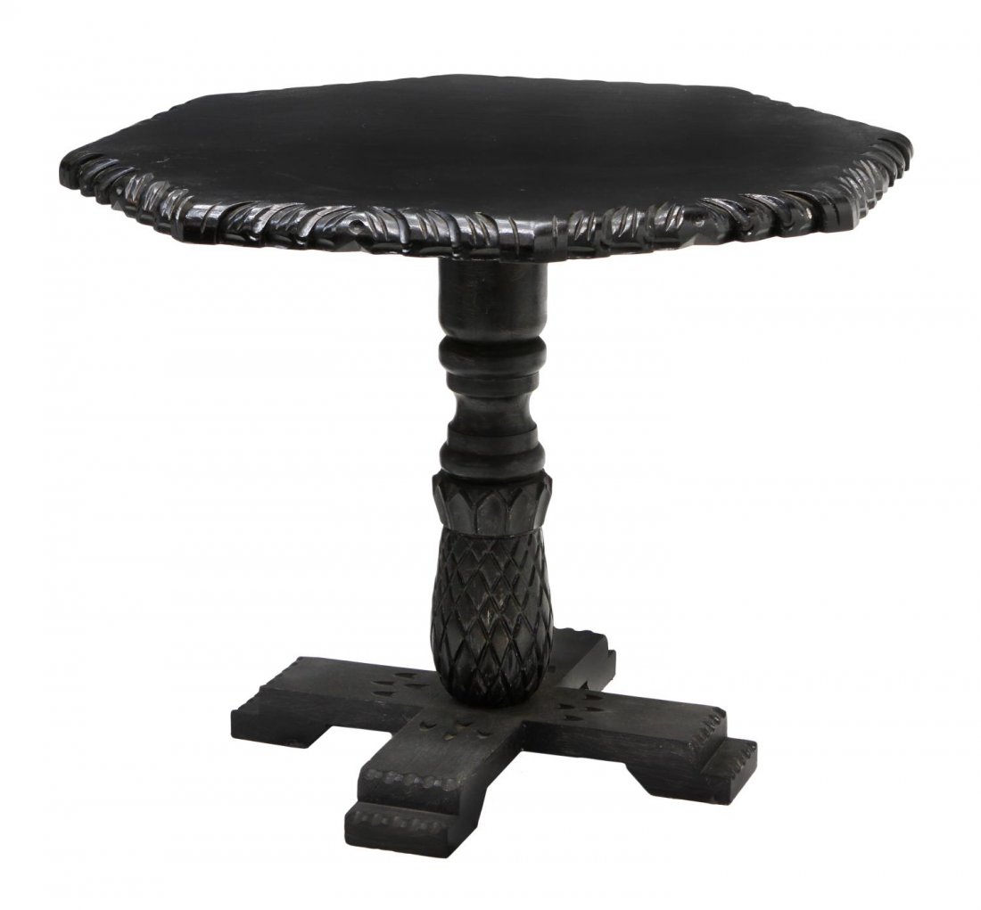 MEXICO EBONIZED CARVED WOOD OCTAGONAL TABLE: Ebonized wood dining / center table of octagonal form, Mexico, having carved edge, turned pineapple stem on an x-form base, approx 30"h, 35"w *Provenance: The estate of Douglas B. Marshall (1917-2007)