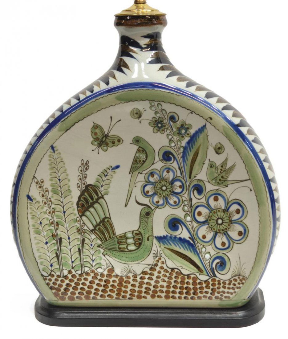 VINTAGE FOLK ART POTTERY VASE / TABLE LAMP, MEXICO: Vintage folk art pottery vase, now mounted as a table lamp, Mexico, body of flattened form, climbing central decor with birds and butterflies among foliage, two-sockets, overall crazing and minor pitt