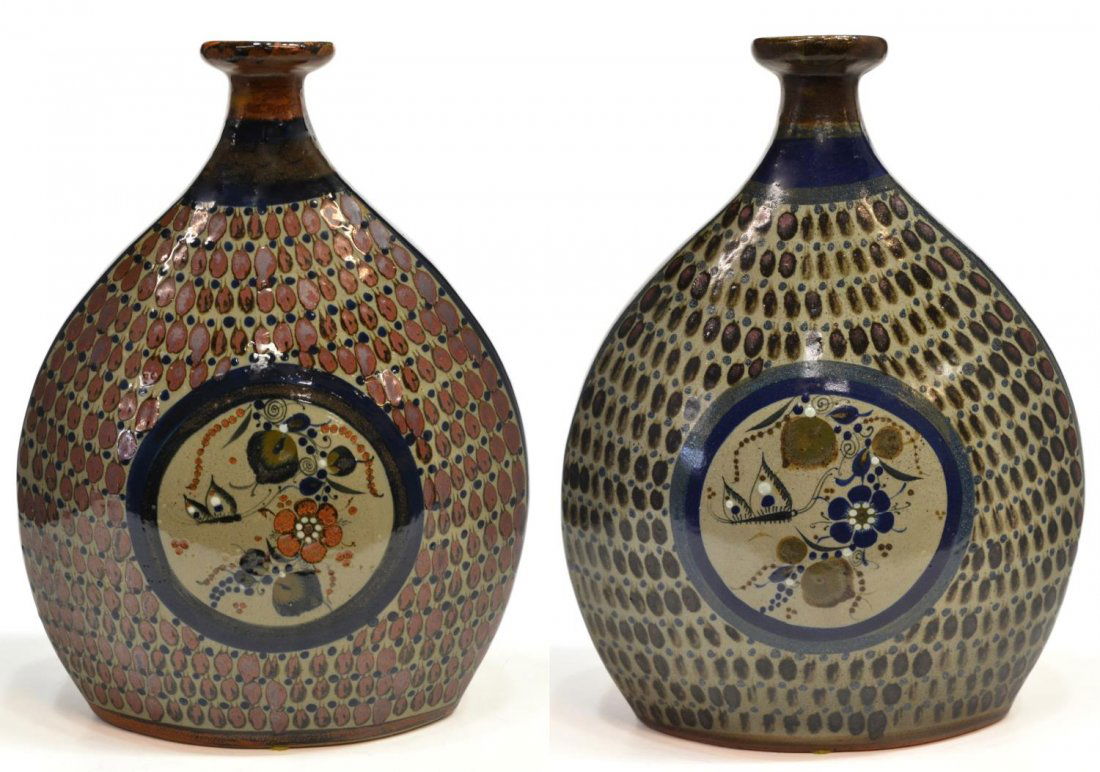(2)SALVADOR VASQUEZ FOLK ART POTTERY VASES, MEXICO: (lot of 2) Mexican folk art pottery vases, by Salvador Vasquez (Mexico, 20th c.), each of flattened form having polychrome center of butterflies among climbing foliage, signed S, Tonala, Mexico, appro