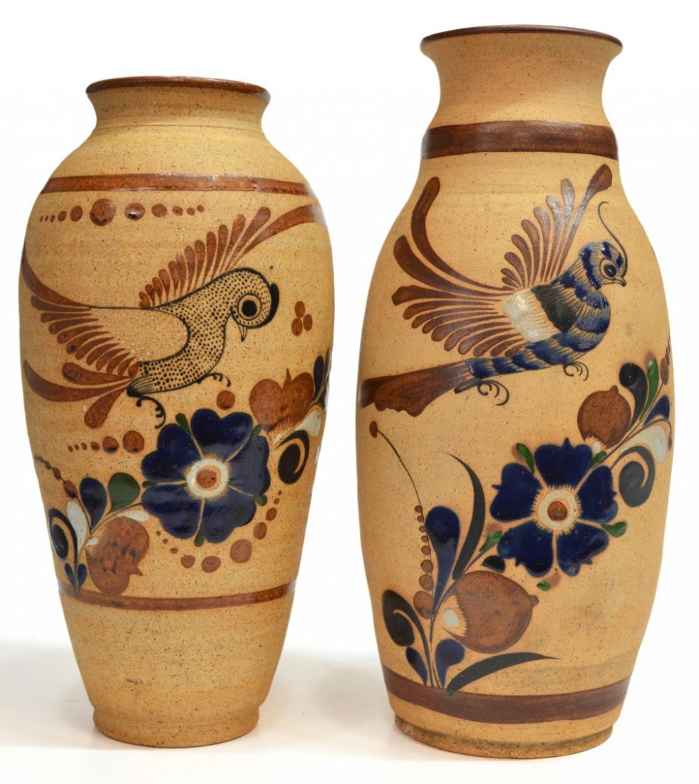 (2) FOLK ART POTTERY BALUSTER VASES, MEXICO: (lot of 2) Folk art pottery vases, each with polychrome glaze bird among climbing foliage, comprising: (1) of oval form, minor chip to base, signed Mex. U. Tonala, approx 14"h; (1) of baluster form, s