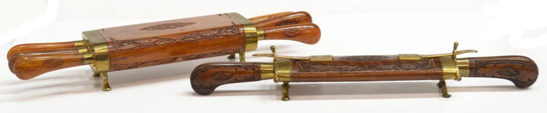(2) VINTAGE WOOD CASED CARVING SET & KNIVES, INDIA: (lot of 2) Vintage cutlery sets, India, housed in foliate carved wood case with brass trim while rising on four brass feet, comprising: (6pc) knife set, six steak knives with hand carved wooden handle