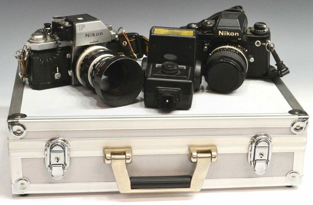 TWO NIKON CAMERAS, NIKON MOTOR DRIVE, ACCESSORIES: (lot of 10) Collection of cameras and accessories, comprising: (1) Nikon F3 HP camera, made in Japan, with Nikon Series E Lens 100mm 1:2.8 no. 2008551, 4.25"h, 6.5"w, 4.25"d; (1) Nikon F camera, made